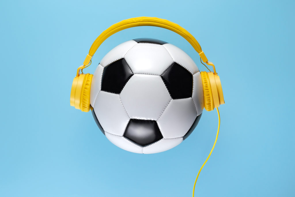 headphones on a soccer ball