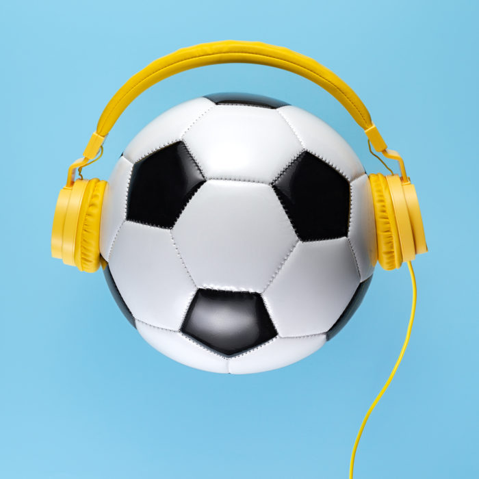 headphones on a soccer ball