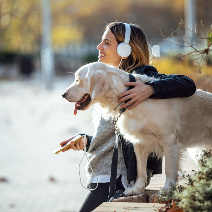 Lady with headphones and dog