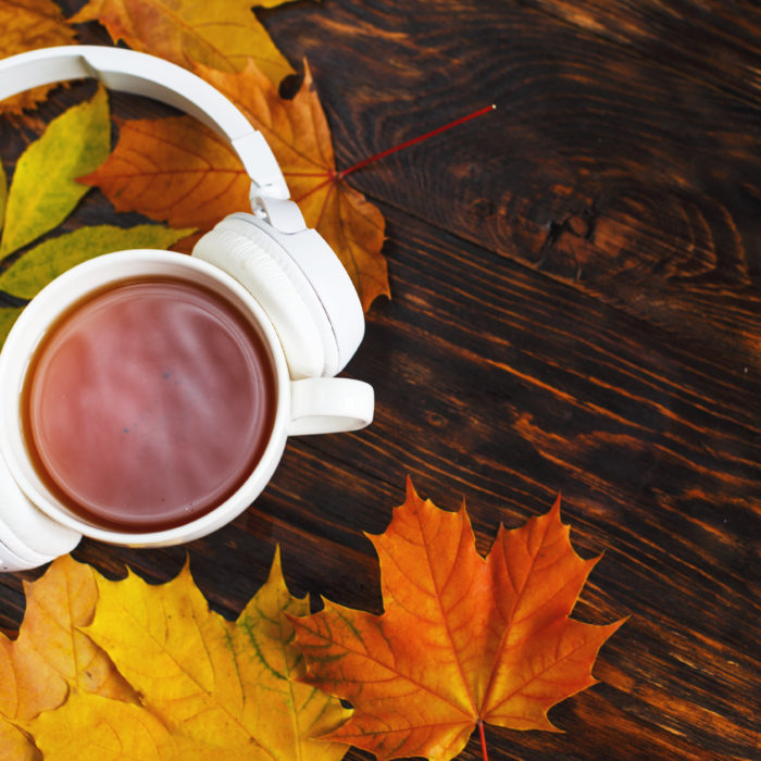 Fall leaves, headphones, and a beverage