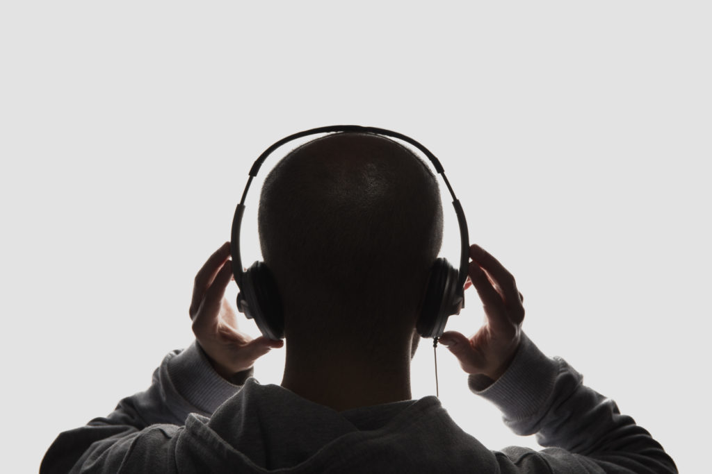 Male silhouette with headphones on
