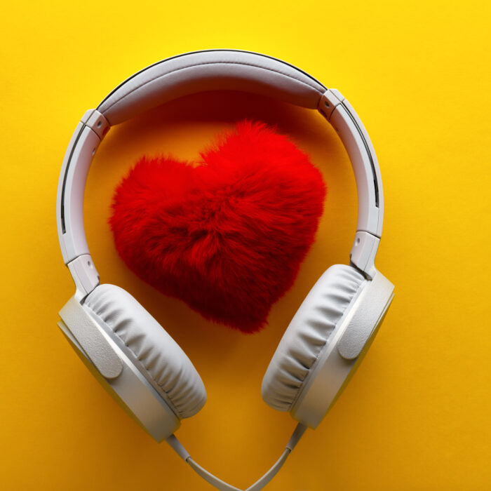 red fuzzy heart, white headphones